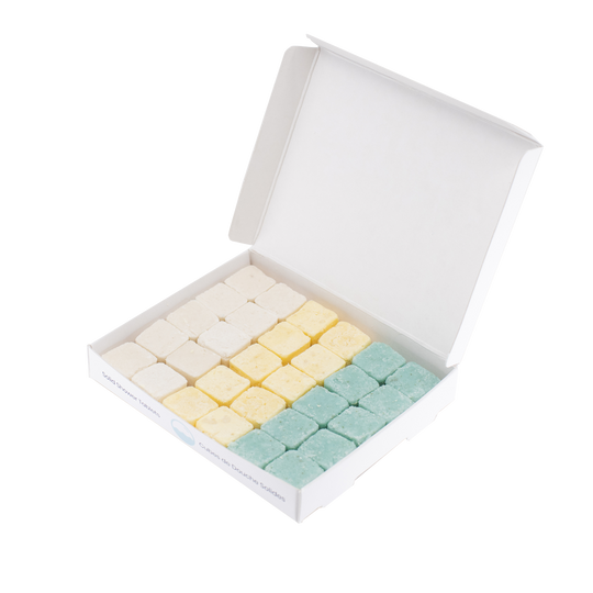 30 waterless, biodegradable, natural, dissolvable tablets in an open recyclable box. 10 tablets each of shampoo (white), conditioner (yellow), and body wash (blue).